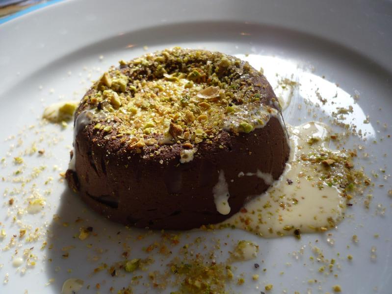 Chocolate marquise with crème anglaise and roasted pistachios.