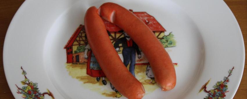 A pair of Strasbourg sausages on a plate