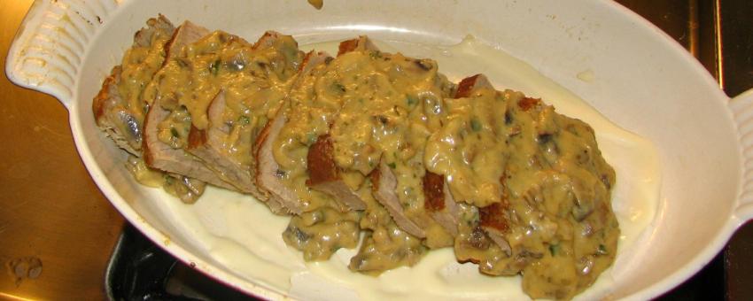 Preparation of veal Orloff. The veal is covered by a soubise-mushroom sauce.