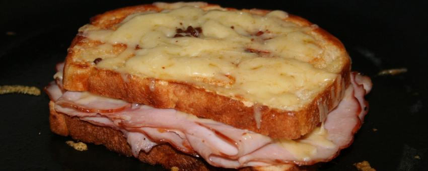 A croque monsieur sandwich still in the oven after broiling.