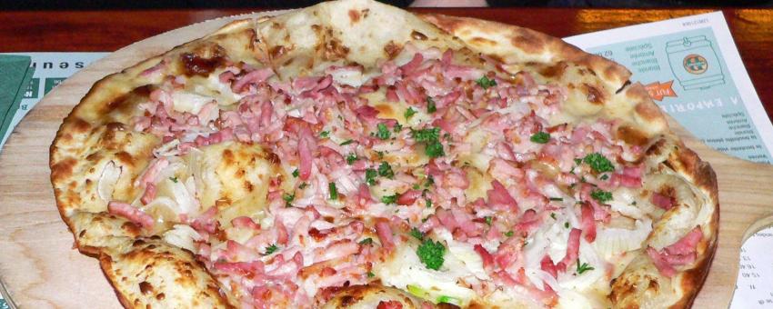 A Flamekeusche (Alsacian pizza-like tarte flambée).