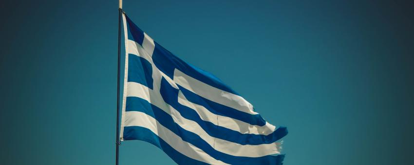 blue and white striped flag placed on pole