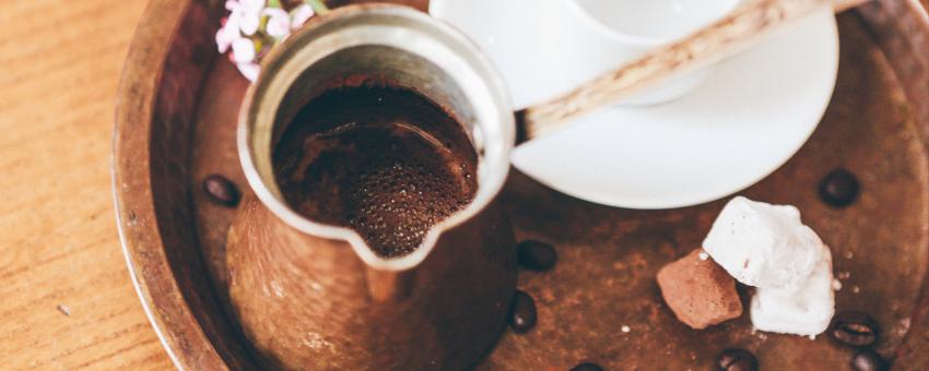 coffee on coffee pot with beans