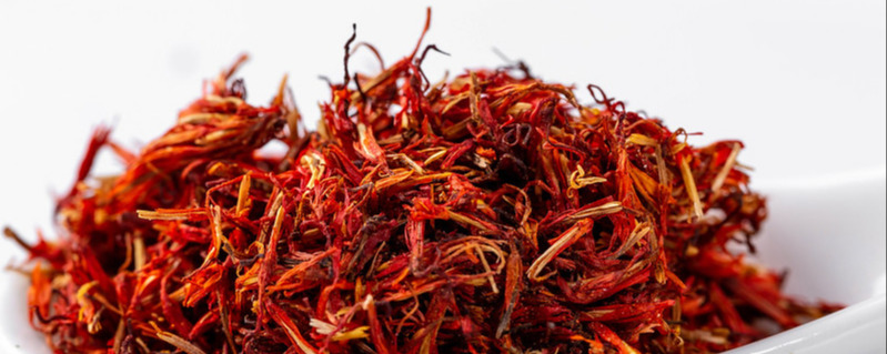 Dried saffron spices on a light background. Close up