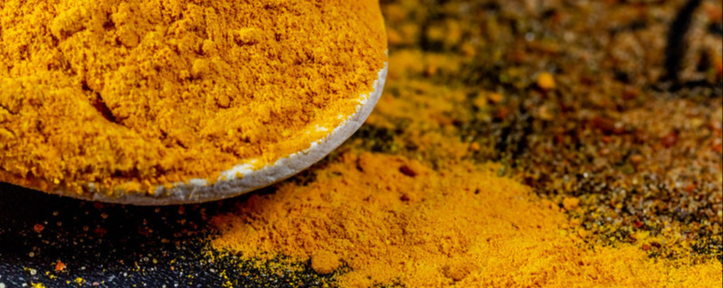 Turmeric powder on dark background