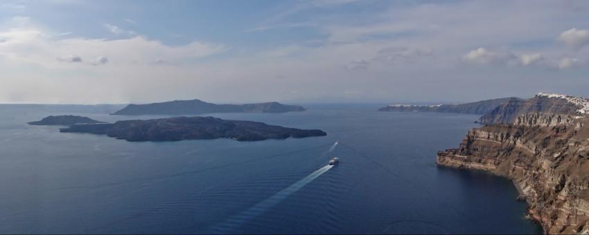 View of the Santorini caldera with the islands of Nea Kameni, Palea Kameni, Therasia and Santorini. Located in Greece