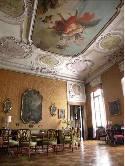 The "Sala Tiepolo" room of Palazzo Barbarigo Minotto in Venice), almost entirely decorated by the Venetian master Giovanni Domenico Tiepolo. 
The wall silks are original Fortuny.